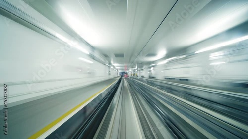Fast underground train riding in a tunnel of the modern city