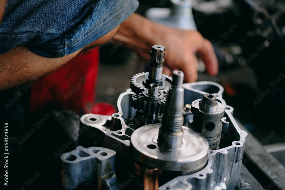 Maintenance and repair of the motorcycle engine transmission system by a mechanic.
Maintenance and repair of the motorcycle engine transmission system by a mechanic.