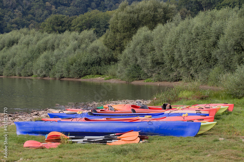 kayaks on the river bank