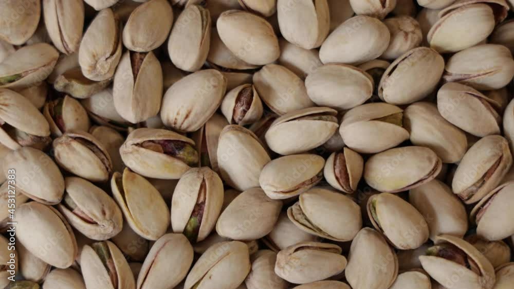 Heap of dried roasted pistachios rotating Heap of dried roasted pistachios rotating