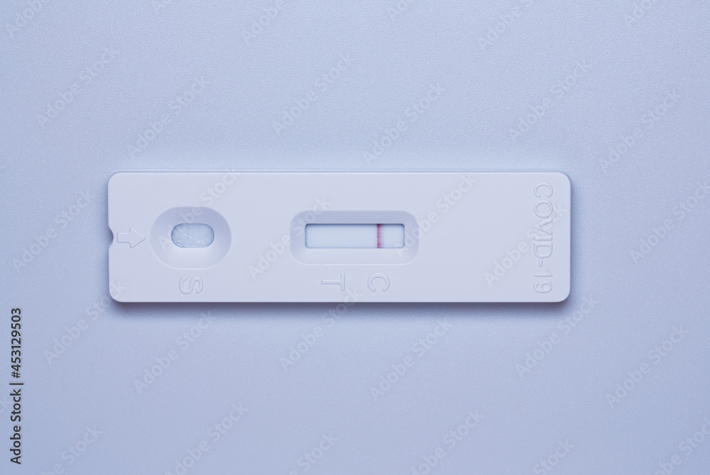 Coronavirus covid19 Ag positive test. Close-up of COVID-19 Antigen Rapid Test on white background. Coronavirus covid19 Ag positive test. Close-up of COVID-19 Antigen Rapid Test on white background.
