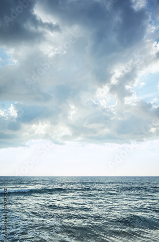 Blue seascape with horizon over water.