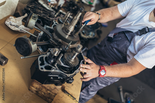 Portrait of a mechanic repairing a car in his garage © Mediteraneo