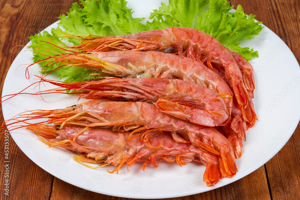 Boiled Argentinian red shrimps on dish, close-up Boiled Argentinian red shrimps on dish, close-up