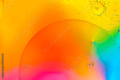 Colorful of oil drop floating on the water.Fantastic structure of colorful oil bubbles