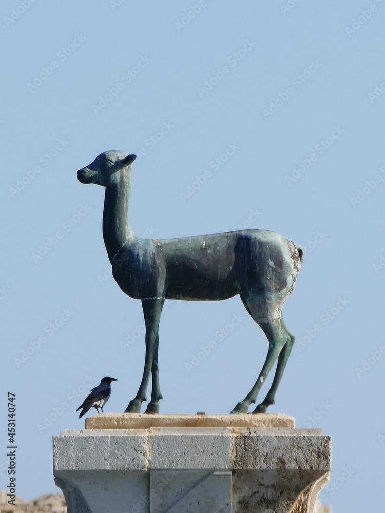 The port entrance of the Mandraki Harbor in Rhodes Town, Rhodes, Greece is guarded by a deer (Elafos) and a hind (Elafina The port entrance of the Mandraki Harbor in Rhodes Town, Rhodes, Greece is guarded by a deer (Elafos) and a hind (Elafina