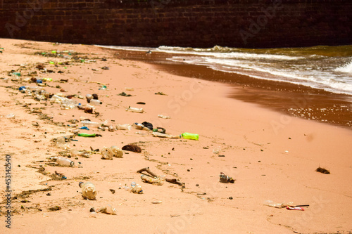 Ocean-Sea Waves Beach Sand and Garbage Background