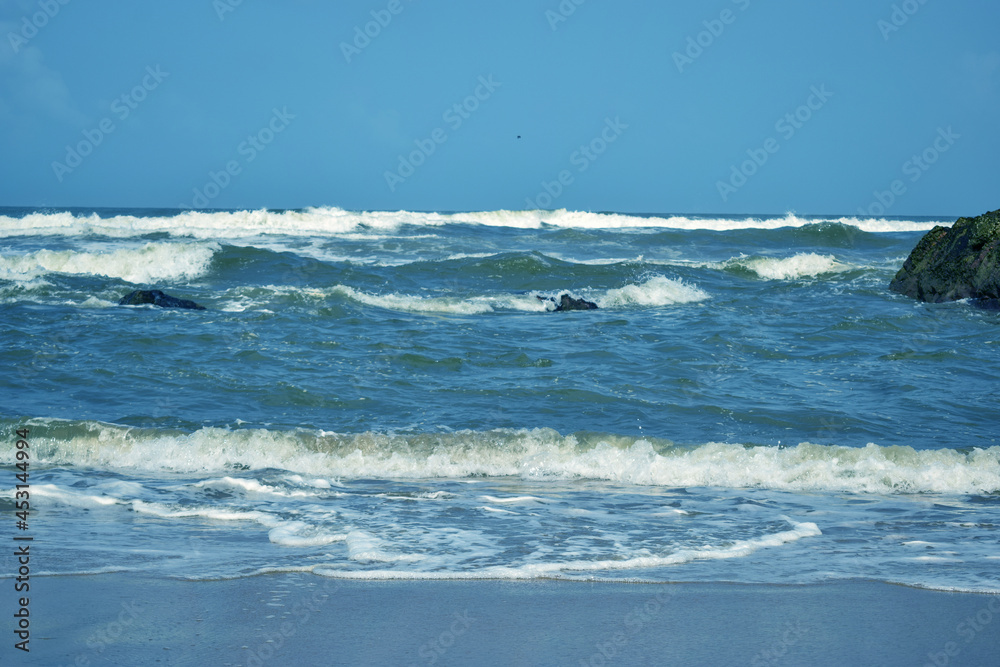 Fototapeta premium Ocean-Sea Waves, Mountains Rock Stones and Sky Blue Landscape Background