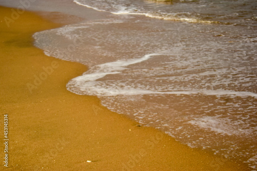 Ocean-Sea Waves Beach Sand and Mountains Yellow Landscape Background
