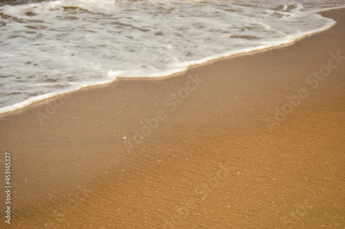 Ocean-Sea Waves Beach Sand and Mountains Yellow Landscape Background