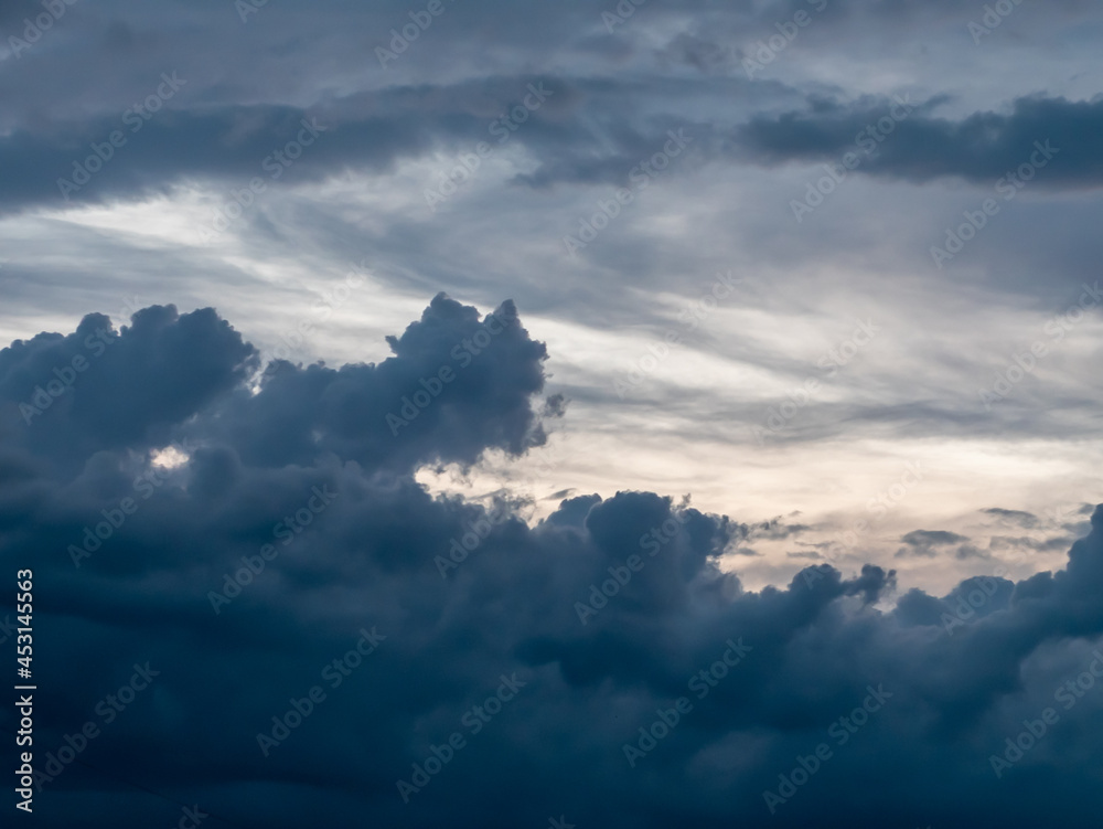 A panorama of the evening sky with dark blue clouds of various shades. A panorama of the evening sky with dark blue clouds of various shades.