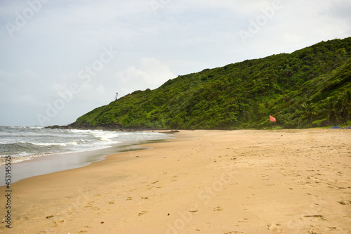 Ocean-Sea Waves Beach Sand and Mountains Yellow Landscape Background
