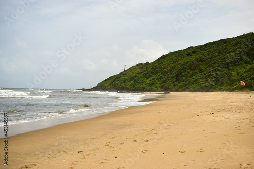 Ocean-Sea Waves Beach Sand and Mountains Yellow Landscape Background © Pleasant Mode Studio