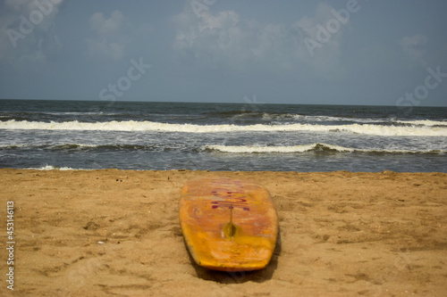 Ocean-Sea Waves, Beach Sand and Wake Surfing Boat Yellow Background 