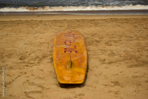 Ocean-Sea Waves, Beach Sand and Wake Surfing Boat Yellow Background 