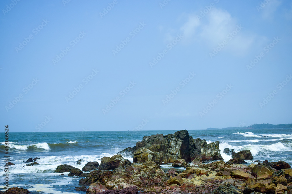 Ocean-Sea Waves, Mountains Rock Stones and Sky Blue Landscape Background Ocean-Sea Waves, Mountains Rock Stones and Sky Blue Landscape Background