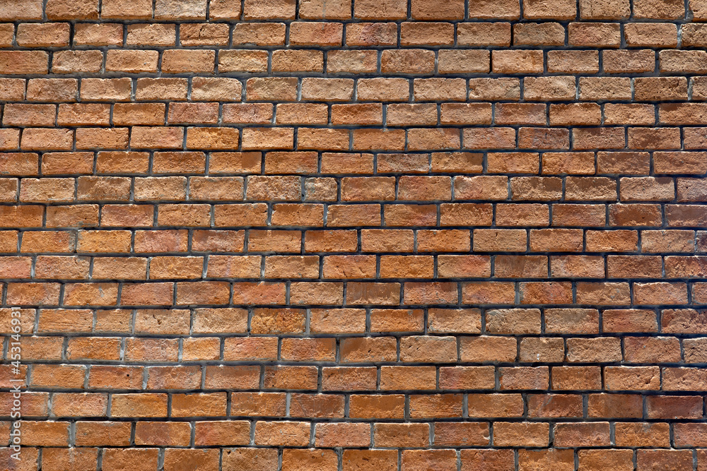 Obraz premium Photo of a wall made of red bricks, background from a wall built inside a building