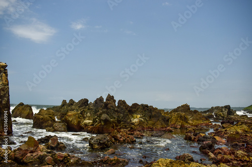 Ocean-Sea Waves, Mountains Rock Stones and Sky Blue Landscape Background