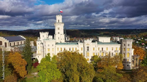 Castle Hluboka nad Vltavou is one of the most beautiful castles in Czech Republic. Castle Hluboka nad Vltavou in autumn with red foliage, Czechia. Colorful autumn view of Hluboka nad Vltavou castle. photo