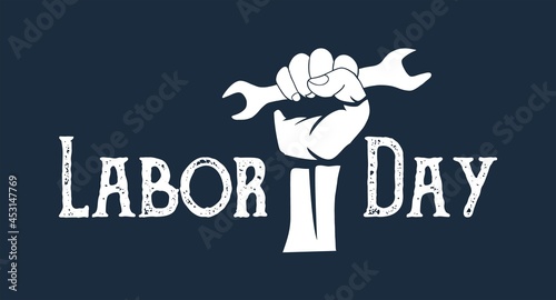 Happy labor day text with hand hold a wrench illustration