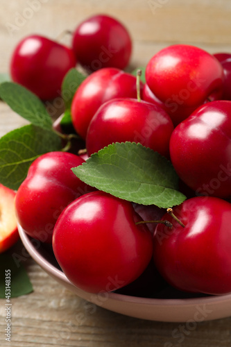 Fresh ripe cherry plums on wooden table, closeup