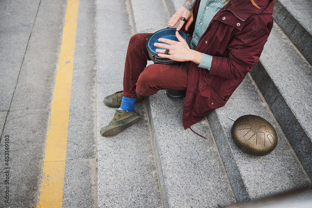 Focused photo on man sitting on the stairs