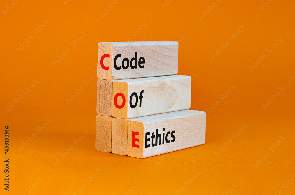 COE, Code of ethics symbol. Concept words 'COE, Code of ethics' on wooden blocks on a beautiful orange background. Business and COE, code of ethics concept. Copy space. COE, Code of ethics symbol. Concept words 'COE, Code of ethics' on wooden blocks on a beautiful orange background. Business and COE, code of ethics concept. Copy space.