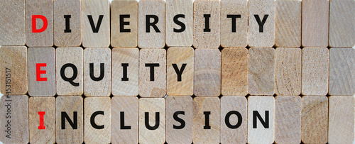 DEI, Diversity, equity, inclusion symbol. Wooden blocks with words DEI, diversity, equity, inclusion on beautiful wooden background. Business, DEI, diversity, equity, inclusion concept. photo