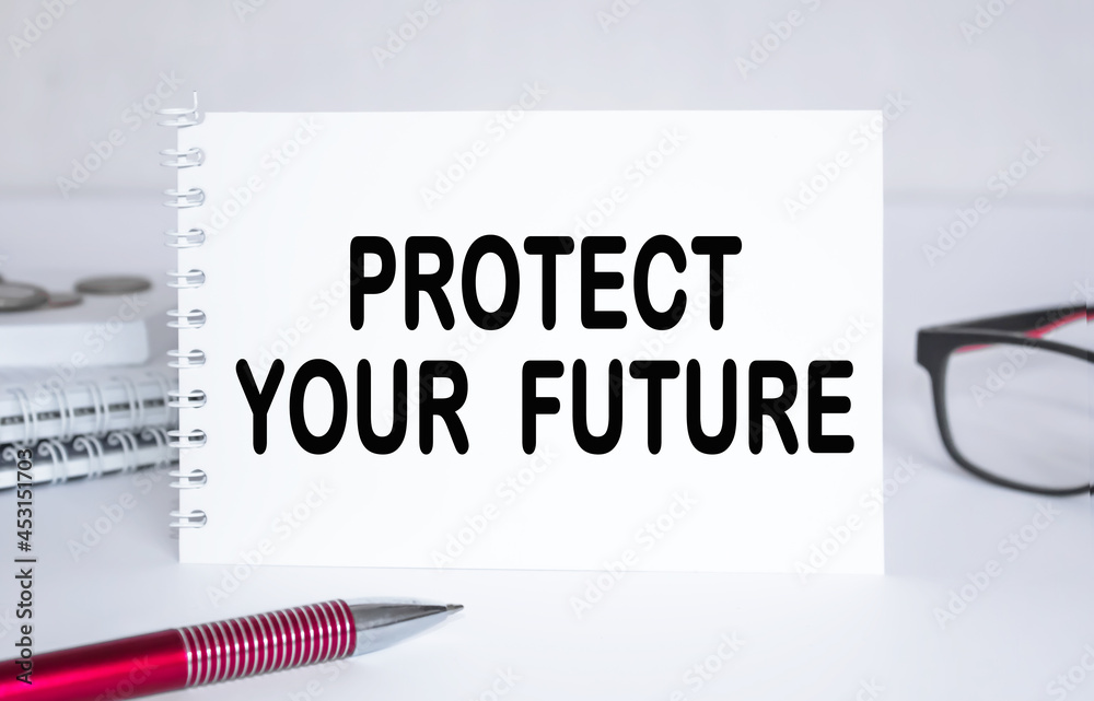 text PROTECT YOUR FUTURE . Notepad with eyeglasses and text documents. Business concept text PROTECT YOUR FUTURE . Notepad with eyeglasses and text documents. Business concept