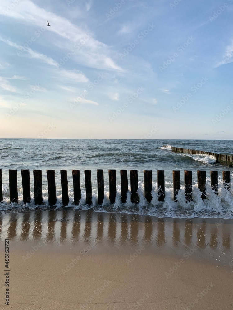 Breakwater construction in the sea, sea horizon, natural colors, romantic atmosphere Breakwater construction in the sea, sea horizon, natural colors, romantic atmosphere