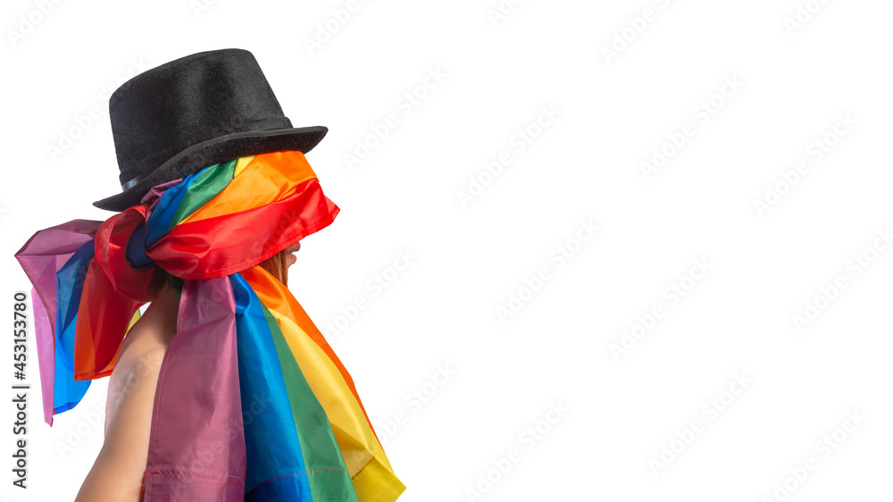 Lesbian woman in black hat wrapped in rainbow flag isolated on white background. LGBT International symbol of the lesbian, gay, bisexual and transgender community. Banner, place for text.