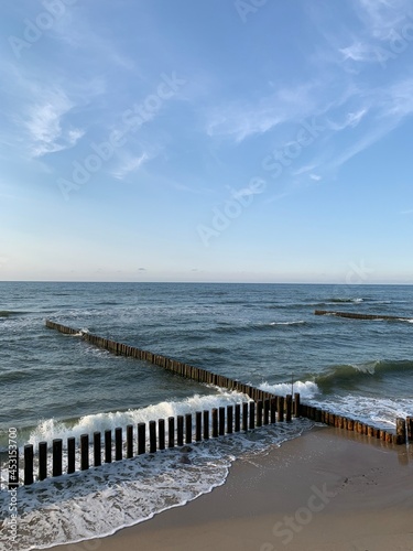 Breakwater construction in the sea, sea horizon, natural colors, romantic atmosphere 