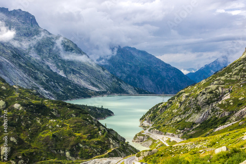 clouds over Grimsel Pass and lake in Switzerland