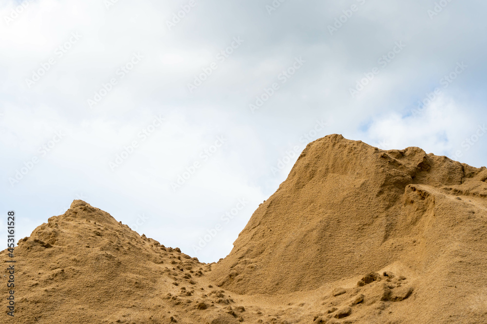 Coarse Sand pile and Find Granular Sand pile and fill Sand pile. used to make concrete  , to create  path , to create  floor. Sand texture , Sand  background and Sand isolated.