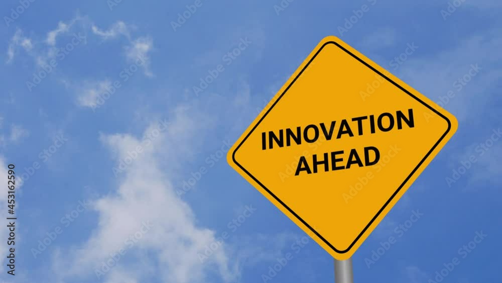 Innovation Ahead Road Sign on Clear Blue Sky with Rapid Moving Clouds for Text Placement Innovation Ahead Road Sign on Clear Blue Sky with Rapid Moving Clouds for Text Placement