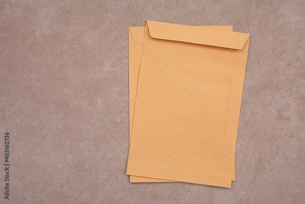 Fototapeta premium brown paper bag,brown envelope front and back isolated on gray background. View from the letter.