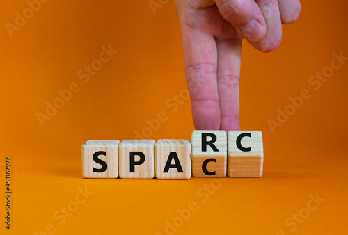 SPARC, special purpose acquisition rights company symbol. Cubes with words 'SPARC, SPAC' on orange background, copy space. Business, SPARC, special purpose acquisition rights company concept. photo