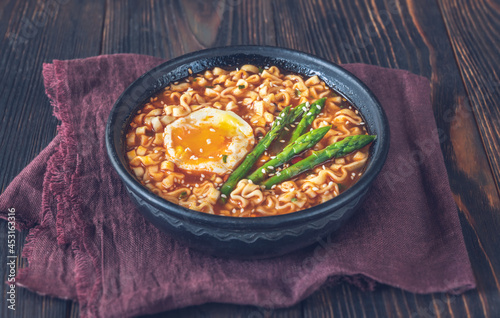 Bowl of ramen with soft-boiled egg and asparagus