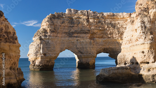 Panoramic view, Ponta da Piedade with seagulls flying over rocks near Lagos in Algarve, Portugal. Cliff rocks, sea and beaches, Algarve region, Portugal. Amazing landscape during summer season. © Michal