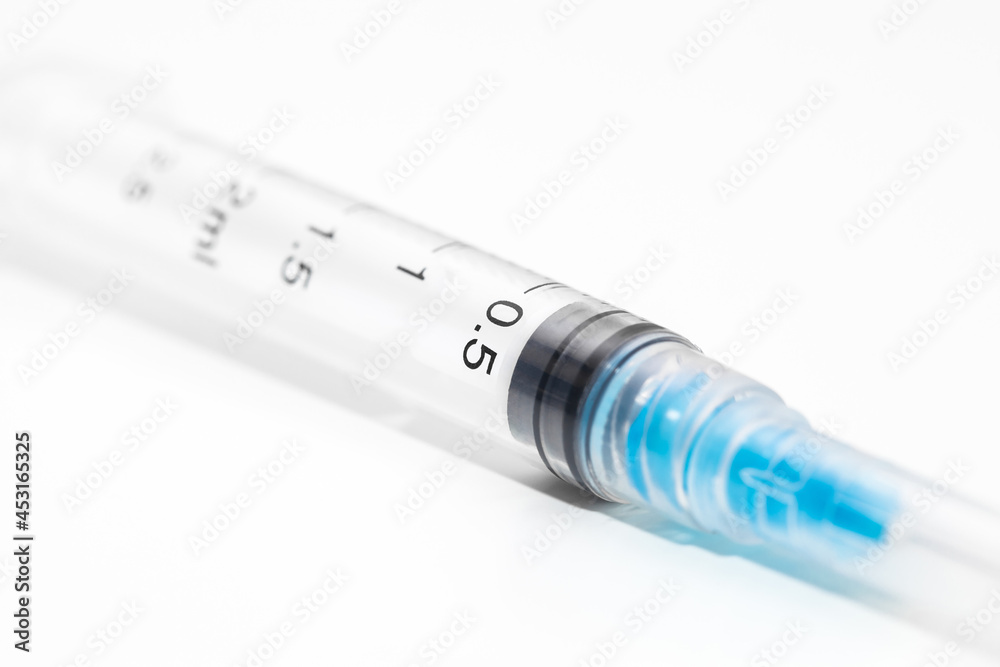 Disposable unused syringe, close-up macro view, bokeh effect Disposable unused syringe, close-up macro view, bokeh effect