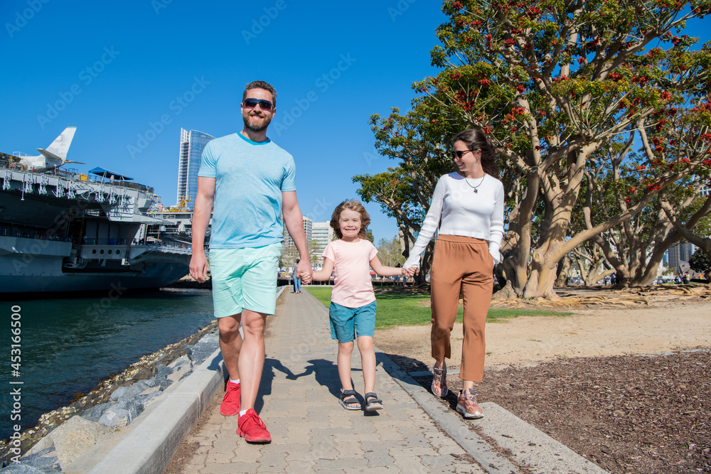adoption and charity. family day. friendship. father mother and child in park. adoption and charity. family day. friendship. father mother and child in park.