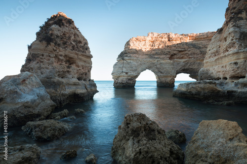 Panoramic view  Ponta da Piedade with seagulls flying over rocks near Lagos in Algarve  Portugal. Cliff rocks  sea and beaches  Algarve region  Portugal. Amazing landscape during summer season.