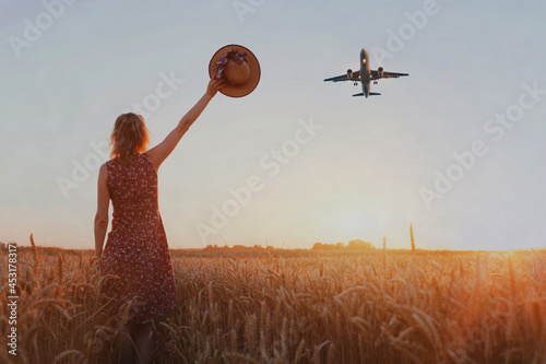 wanderlust travel concept, woman cheering airplane landing photo