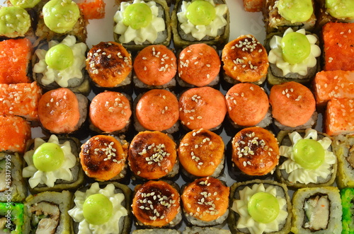 Sushi roll set background top view Japanese food. photo