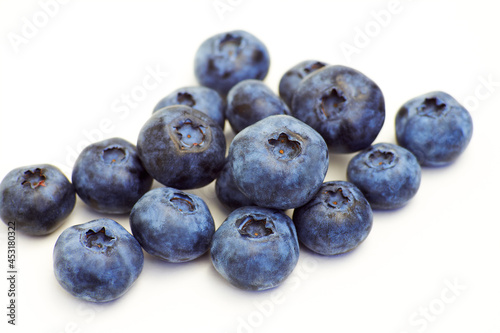Handful of blueberries isolated on white background