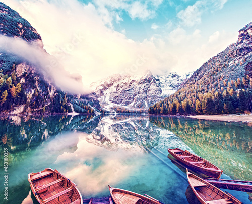 Obraz na płótnie Magical beautiful fairy autumn landscape with boats on the lake on Fanes-Sennes-Braies natural park in the Dolomites in South Tyrol, Alps, Italy, Europe. Exotic amazing places. (harmony - concept) w salonie