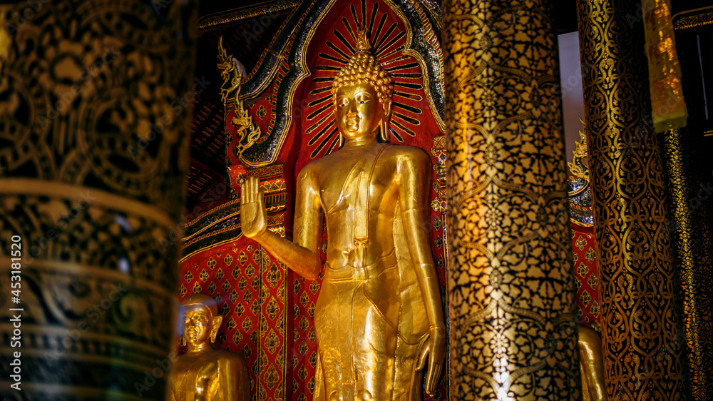 Golden Buddha statue in thai temple, Chiang mai, Thailand