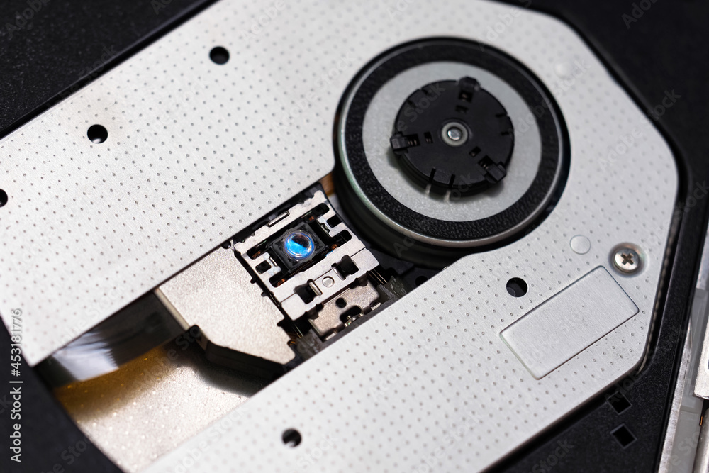 Obraz premium Laptop computer CD-ROM drive. CD DVD reading, laser head of CD DVD