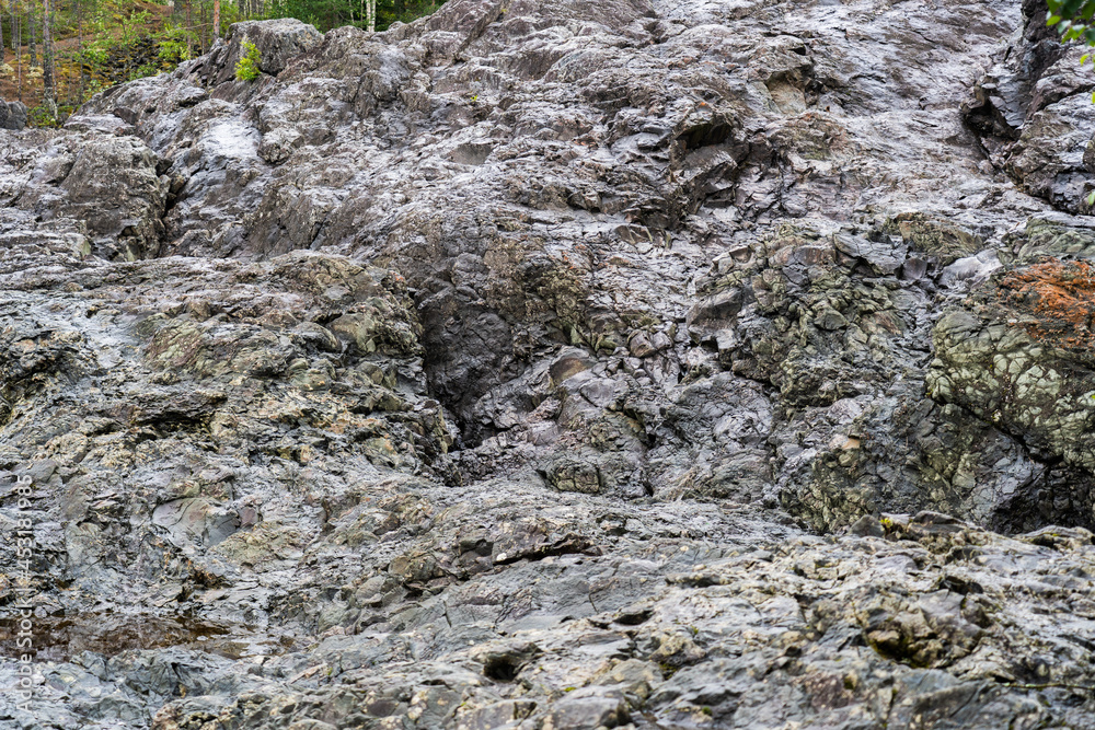 Rocks of extinct ancient paleo-volcano Girvas in Karelia, Russia.