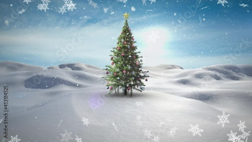 Animation of snow falling over chritmas tree on winter landscape photo